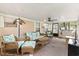 Inviting sunroom with wicker furniture, a ceiling fan, and screened windows, providing a comfortable living area at 6001-Mh107 S Kings Hwy., Myrtle Beach, SC 29575