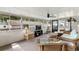 Bright sunroom with wicker furniture, ceiling fan, and screened windows, offering a cozy living space at 6001-Mh107 S Kings Hwy., Myrtle Beach, SC 29575