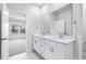 Bathroom showing double vanity with plentiful of light from the window and recessed lighting at 7004 Watercress St, Myrtle Beach, SC 29579