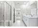 Bathroom featuring a glass-enclosed shower, and a double vanity at 7004 Watercress St, Myrtle Beach, SC 29579