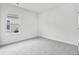 Bedroom featuring neutral carpet and a window to the backyard at 7004 Watercress St, Myrtle Beach, SC 29579