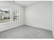 Carpeted bedroom with window view of a suburban street at 7004 Watercress St, Myrtle Beach, SC 29579