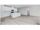 Modern kitchen with white cabinetry, tile backsplash, stainless steel appliances and open floor plan at 7004 Watercress St, Myrtle Beach, SC 29579
