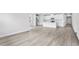 Bright kitchen, featuring white cabinets, stainless steel appliances, and wood look floors at 7004 Watercress St, Myrtle Beach, SC 29579