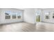 Bright and airy living area with ample natural light, featuring wood look floors and a glass patio door at 7004 Watercress St, Myrtle Beach, SC 29579