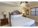 King bedroom with dark wood furniture and ceiling fan at 100 North Beach Blvd. # 1819, North Myrtle Beach, SC 29582