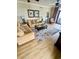 Bright living room with comfy sofas, coffee table, and hardwood floors at 100 North Beach Blvd. # 1819, North Myrtle Beach, SC 29582