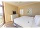 King-size bed, dresser, and balcony access in this bright bedroom at 100 North Beach Blvd. # 1819, North Myrtle Beach, SC 29582