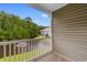 Balcony view overlooking a pond and lush trees, with a building visible beyond at 1137 Peace Pipe Ln. # 201, Myrtle Beach, SC 29579