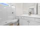 Bright white bathroom featuring a shower, toilet, vanity, and mirror at 1137 Peace Pipe Ln. # 201, Myrtle Beach, SC 29579