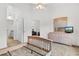 Spacious bedroom with a light wood bed frame, dresser with a mirror, and access to other rooms at 1137 Peace Pipe Ln. # 201, Myrtle Beach, SC 29579