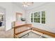 Well-lit bedroom with a light wood bed frame, dresser with a mirror, and a large window for natural light at 1137 Peace Pipe Ln. # 201, Myrtle Beach, SC 29579