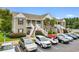 Well-maintained condo building featuring covered entrances and convenient parking spaces at 1137 Peace Pipe Ln. # 201, Myrtle Beach, SC 29579