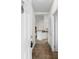 Bright hallway leading to the kitchen, featuring white doors and neutral tones at 1137 Peace Pipe Ln. # 201, Myrtle Beach, SC 29579