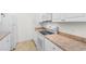 Kitchen with stainless steel sink, white appliances, and light countertops at 1137 Peace Pipe Ln. # 201, Myrtle Beach, SC 29579