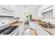 Kitchen with stainless steel sink, white appliances, and light countertops at 1137 Peace Pipe Ln. # 201, Myrtle Beach, SC 29579