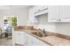 Kitchen with stainless steel sink, white appliances, and light countertops at 1137 Peace Pipe Ln. # 201, Myrtle Beach, SC 29579