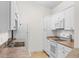 Kitchen with stainless steel sink, white appliances, and light countertops at 1137 Peace Pipe Ln. # 201, Myrtle Beach, SC 29579