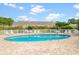 Community pool with brick patio and lounge chairs for residents' enjoyment at 1137 Peace Pipe Ln. # 201, Myrtle Beach, SC 29579