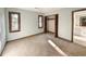 Well-lit bedroom with double closets and adjacent bathroom at 202 Snowbell Ln., Pawleys Island, SC 29585