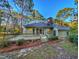 Back exterior view, highlighting the deck and landscaping at 202 Snowbell Ln., Pawleys Island, SC 29585