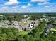 An aerial view showcases a residential neighborhood near a green park and a glimmer of the ocean in the background at 3015 Old Bryan Dr. # 13-1, Myrtle Beach, SC 29577