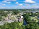 An aerial view showcases a residential neighborhood, surrounding trees, and a glimpse of the ocean at 3015 Old Bryan Dr. # 13-1, Myrtle Beach, SC 29577