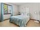Comfortable bedroom featuring a cozy bed, a bright window, and neutral-toned walls and carpeting at 3015 Old Bryan Dr. # 13-1, Myrtle Beach, SC 29577