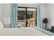 Bright bedroom with sliding glass doors leading to outdoor balcony and natural lighting at 3015 Old Bryan Dr. # 13-1, Myrtle Beach, SC 29577