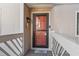 Welcoming entrance with a red door, coastal decor, and a charming doormat at 3015 Old Bryan Dr. # 13-1, Myrtle Beach, SC 29577