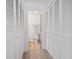 Bright hallway lined with built in storage leading to the ensuite bathroom at 3015 Old Bryan Dr. # 13-1, Myrtle Beach, SC 29577