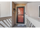 A welcoming front door with glass pane, stylish hardware, and a charming welcome mat awaits you at 3015 Old Bryan Dr. # 13-1, Myrtle Beach, SC 29577
