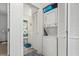 Functional laundry room with stacked washer and dryer, as well as a view of the adjacent bathroom at 3015 Old Bryan Dr. # 13-1, Myrtle Beach, SC 29577