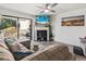 Comfortable living room with modern fireplace and sliding glass door to a balcony at 3015 Old Bryan Dr. # 13-1, Myrtle Beach, SC 29577