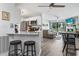 A cozy living room and a modern kitchen offer a blend of comfort and functionality in an open layout at 3015 Old Bryan Dr. # 13-1, Myrtle Beach, SC 29577