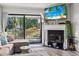Relaxing living room area featuring a fireplace and a view to the outdoor balcony at 3015 Old Bryan Dr. # 13-1, Myrtle Beach, SC 29577