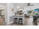 The bright living room features a modern kitchen, a dining area, and a fireplace visible from an inviting space at 3015 Old Bryan Dr. # 13-1, Myrtle Beach, SC 29577