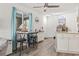 Charming living room with a dining area, bright windows, and stylish decor to create a cozy and inviting atmosphere at 3015 Old Bryan Dr. # 13-1, Myrtle Beach, SC 29577
