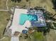 Aerial view of community swimming pool and deck surrounded by tall trees at 3015 Old Bryan Dr. # 13-1, Myrtle Beach, SC 29577