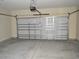 Garage with automatic door opener and concrete floor at 110 Hallandale Lane # Left, Murrells Inlet, SC 29576