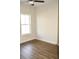 Bright bedroom with wood-look floors and large window at 110 Hallandale Lane # Right, Murrells Inlet, SC 29576