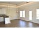 Open concept dining area with kitchen island and hardwood floors at 110 Hallandale Lane # Right, Murrells Inlet, SC 29576