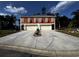 Front view of two-unit building with attached garages at 110 Hallandale Lane # Right, Murrells Inlet, SC 29576