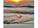 Stunning sunrise over the ocean with waves gently rolling onto the shore at 110 Hallandale Lane # Right, Murrells Inlet, SC 29576
