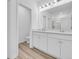 En-suite bathroom with double sink vanity, white cabinets, and a glass enclosed shower at 385 Sun Colony Blvd., Longs, SC 29568