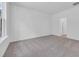 Bright and airy bedroom showcasing natural light with neutral carpet and paint throughout at 385 Sun Colony Blvd., Longs, SC 29568