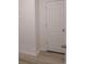 Hallway with wood flooring and a white door at 385 Sun Colony Blvd., Longs, SC 29568