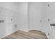 Laundry room features wood flooring, wire rack, and hookups at 385 Sun Colony Blvd., Longs, SC 29568