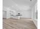 Open concept living-kitchen area with recessed lighting and luxury vinyl plank flooring at 385 Sun Colony Blvd., Longs, SC 29568