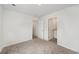 Bright bedroom with neutral carpeting and white walls with access to an ensuite bathroom at 230 Ashworth Dr., Tabor City, NC 28463